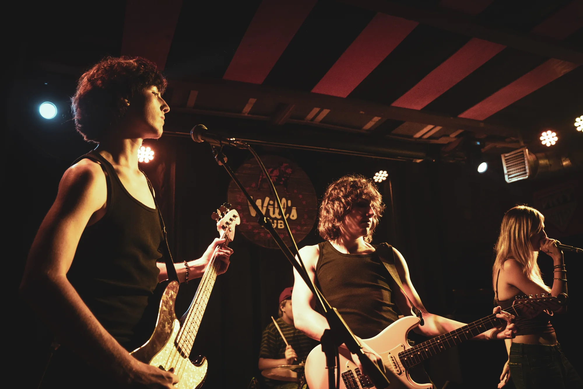 Bleached Son playing together across the Will’s Pub stage